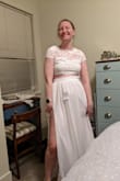 From the photos I thought far and away this would be my favorite dress, but trying it on I was underwhelmed. The shirt was tight and long and was uncomfortable around my waist. The top was cute, but also small and the capped sleeves were uncomfortable. I wanted to use it as a reception dress, but it just felt a little cheap and was comfortable. I returned it. - Katie W.