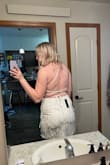 I got this dress for my bachelorette party & it's going to be perfect. It is a little outside my comfort zone because I don't have a "toned" back & my couple of rolls do show but the dress is so cute that I'm going wear it anyways. You definitely need someone else to tie it! I'm 5'10" & the dress covers my butt which has always been a struggle. I love that you can adjust the tightness of the top with the adjustable crisscross straps. It's NOT see through which has been a huge struggle for me finding dresses for my wedding events. Overall love the dress & I'm excited to wear it in June! - Lauren G.