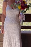 CONS: #1): At my reception one of the straps broke; Thankfully I had safety pins with me, and my sister helped me pin it.  #2): the stitching near the 'hook' at the top of the zipper was coming out when I received it but I didn't have time to return for another one (re: wedding date!).  I hand-sewed it to reinforce it.   Additionally, the zipper was a bit hard to zip.
PROS:  I loooved everything about this dress, and out of 4 wedding dresses I chose this one! I did have a seamstress sew in small cups -I'm "small" up top.  I tried a medium and a small, and the small fit perfectly -I probably could have gone without the sewed-in cups, but I wanted a "little" cleavage lol.  I felt very comfortable in it and had lots of great comments on it! I wanted to add a few more photos but the review process wouldn't let me. - Ba H.