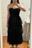 For someone 5'4 it hits right below the mid-length of the shin. The straps are adjustable but flimsy and keep getting loose/longer, required constant adjusting during wear. Otherwise it is a flattering dress, would recommend. - Rachel H.