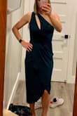 The dress was awesome! I wore it to a wedding and got SO many compliments. The material is thick so I felt well covered and the cut was comfortable and cute. I didn't really want to change out of it for the late night festivities. The zipper was a little sticky but functional. I actually ordered this in both a XS and a S. I kept the small as it was flattering and comfortable. If you prefer a tighter fit, the XS might work for you. Great buy for the price! - Sarah Y.