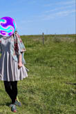 I bought this dress for a friend of the family's wedding. When I first tried it on (under white LEDs), it looked beige. Then outdoors, at the wedding, it was decided that the color was a pale lavender. Never once did I look at the dress and thought it could classify as grey. As with all tall women and dresses, the hemline came to about 3in above my knee, and the waistline (with the spaghetti straps fully extended) never sat below my ribcage.

Hindsight being 20-20, I should have returned the dress and wore slacks and a button-up to the wedding. - Bethany M.