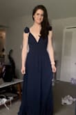This dress fit me to a T, I wasn't sure about the ruffles at first, but I love it! I'm so excited to wear it. 

I would say though I am at the smaller side of a M according to the size chart. I'm about 28" waist and I am at capacity in this dress. It fits, but it's snug. That works for me, but I know that might be uncomfortable for others. I would size up if you're in between sizes. - Alisz H.