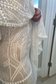 The fit was perfect, however, the zipper was stiff and hard to zip on the cross seam halfway up. It definitely has a beige undertone under the white lace. Very comfortable and lots of room to sit and move around in. Just not for me. - Jennifer W.