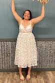 I'm between M & L & went with M! It was a little difficult to get zipped. Not because it was too small but the zipper just got stuck on the material. Lots of compliments though, so cute! - Heidi E.