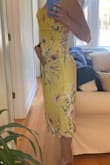 This dress is not pastel yellow or silky. It looks horrible on. - Colleen C.