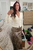 I loved this outfit so much I wanted to replicate it. I had to purchase a slightly different sweater since the one on the model was sold out. Wore this outfit to work recently and felt great in it. Only one small issue for me. Because I have a small waist and bigger hips the skirt would slide up and I would tug on it to pull it back down. Not a huge deal, I just like the length better when I pull it down to sit more on my hips. I paired it with navy flip flops because hey, I live in Socal so I live in flip flops but this skirt can be dressed up or down so it's very versatile.
*ignore disaster of a room. Just got back from a trip :) - Aimee C.