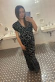 I absolutely love this jumpsuit! I had to get it hemmed because it was very long for me (5'1") but the rest fit perfectly. There are two ties in the back so I always needed help getting back into it after going to the bathroom. A bit hard to wear a bra since it's backless. The sleeves also have this perpetual flowyness that makes them look inside out at times. - Renatta M.