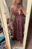 The dress is even more stunning in person, but I unfortunately had to return it. The top fits me nearly perfectly, but I just couldn't get over how HUGE the bottom is. There is probably at least an extra foot of material in the skirt it made me look way larger than I am. If alterations were in my budget to remove material from the skirt, I would've 100% kept the dress.
I am 5'9" and the dress was probably hanging 1/2" on the floor, so the length was perfect for tall girls! - Libby E.