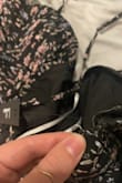 First, listen to the reviews when they tell you the zipper gets stuck. I really liked the dress so I exchanged it for another one hoping it would solve the problem. The second one did the same thing. Since I was only wearing it once, I just worked it a lot when the day came. Second, the second time I put it on the strap broke. I thought I fixed it until I sneezed in the middle of the ceremony. The whole silver ring flew off and I couldn't find it. I wanted to love it so much, but I suggest going for a different one. If you still decide to buy it, size down. I'm usually a medium 4/6ish and I bought the small. - Colby W.