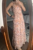 This dress is true to size. The colors are representative in the pictures and real life too. Very light and flowy and perfect for a summer wedding. - Christine P.