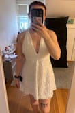 I absolutely love this dress! I always worry about white dresses being see-through, but this one is not! It's the perfect length, and the straps in the back are so cute. The top part is a little tight, but I was still able to fit into my normal size. If you have a larger chest/rib cage, I would size up, but since the bottom is flowy you only have to worry about the fit of the top. - Alisa L.