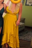 Loved the dress, the color is amazing. It has no support in the upper part but with the right tape, everything stays in place. Wore it for a formal day wedding. - Daniela A.