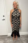 This just made me feel very sexy. I wear it to a college alumni affair. Material has an underlay and the lace is black. Only critique would be that for me at 5 foot three the length of the train in the back was a bit long, and I found the heel of my shoe catching in the lace. Really love this dress. - Charleen S.