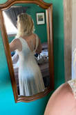 I was worried seeing reviews about this being small. I'm usually between a medium and a large. Size 10 in pants, but sometimes an 8 in dresses. I ordered a medium and It barelyyyy fit. Wouldn't zip with a bra on, but got it to zip without.
That said. I friggen love it. It is so soft and flowy and the chest feels super secure. My one complaint is that the seam in the center of the stomach is crooked! Other than that it's like a second skin and I can't wait to wear it! - Alexandra R.