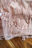 I ordered this for my 14 year old's grade 9 grad. The fit is good but I'm a bit disappointed with the product. One of the little tassle pieces has been sewn into a seam and the stitching in general isn't the greatest quality. I would expect a bit more a dress this price. - Des M.