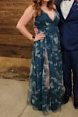 I love this dress! I wore it to a wedding and got so many compliments on it! I got a size small and it was a little tight in the waist but not unbearable. I'm smaller chested so I feel like if I had sized up to a medium it would be been way too big in the bust, so I'm glad I went with a small. I did have to hem it but that's no surprise since I am pretty short. The color is gorgeous! The slits do go up pretty high but the tulle overlay helps to give you that sense of coverage while still being very sexy! - Georgeann V.