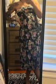 I got this for a wedding & cant wait to wear it. I'm sometimes a medium, sometimes a large and the medium fit me. If you are bigger than a B cup and between sizes then I would suggest sizing up. The pleating style is forgiving and flattering. - Gina M.