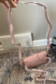 So in the picture that it shows, that I see, looks to me like a nude color, even tho it says mauve pink. Well I LOVE the color PINK and I think my order is more mauve pink which is totally fine a little smaller inside than I was thinking but I still like it and it works, I do like that there is a "crossbody strap" the gold chain that could be a use of a strap and the "belt strap" like a fanny pack or the way in the pic. So I'm happy w/it. - Cashmere O.