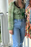 The color green is exactly as pictured. It was a little loose in the boob area, but nothing I couldn't work with, the ties help the looseness. - Megan C.