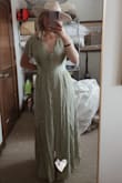 At first sight, I was in love with this dress. I went with the suggested size Lulus gave me and it was a large. When I tried on the size it was clearly too big for me, then I ordered a medium which is my normal size and it fit perfectly and hugged all the right places. The zipper for the dress is along the side which proves to be mildy difficult to put on yourself. The color looks exactly like the photos. Overall I'm impressed with this dress. - Maddie L.