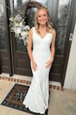 The dress's lace is beautiful. We did have to hem the dress, but I would rather have that option than it being too short. - Katy A.