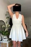 I ordered a size small for reference. The dress is beautiful with high quality fabric that feels sturdy and not see-through at all. Love the flare on the bottom half and the open back is stunning! Will say the dress runs a little large, it feels a little loose, so you can size down maybe if you are between sizes. - Paige K.