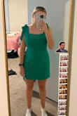 the material does not have anyyyy give. i ordered a size M and i usually run S/M. a L might have been a bit too big. the color is exactly like the photo and the material is very good. I bought for a spring wedding and i think it will be perfect. - Victoria M.