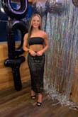 THE SKIRT IS EVEN MORE BEAUTIFUL IN PERSON. LOVED IT!  THE TOP ON THE OTHER HAND RAN SMALL AND THERE IS NO GIVE.  I BOUGHT AN XS AND THAT IS WHAT I ALWAYS WEAR, BUT THE TOP WAS RESTRICTING. I ENDED UP PAIRING THE SKIRT WITH A PLAIN BLACK BANDEAU TOP - RENEE H.