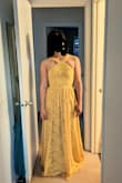 This is another beautiful dress from Lulus. The yellow is not super bright, it's a little muted and looks beautiful. The dress in the photo is size S and is a little small because the person wearing it is in between size S and M in Lulus dresses and the fabric of this dress has no give. The style and color are very flattering and the fabric is very summer. - Lidia R.