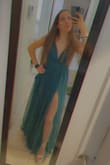 I absolutely loved the color! That was the original color I was looking for my prom dress but I couldn't find it anywhere but I found it here. It runs a little long so I had to go and get it cut to the proper length so I wouldn't step on it. The dress fits great otherwise. It's not loose around my chest or anything. The little straps at the back are adjustable. The slits are amazing and sexy! - Isis S.