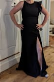 I'm a size 10/medium but ordered a large. I'm so glad I did because it fits well but is a little tight even with shape wear. It's a beautiful heavy material. It's lined. I'm 5'5" and in order to easily walk in it, I'm having it hemmed. It's a stunning dress that looks like a million bucks. I can't wait to wear it to some upcoming events! - Katie M.
