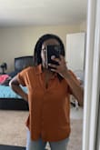 Great top, even for the price which is quite high. Easy to wear, lightweight and breathable fabric. Does wrinkle easily so be sure to iron or have a steamer. Even so, be comfortable with wrinkles throughout the day. Will definitely be wearing this often. - Sabrina D.