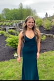 My daughter wore this to prom. It was beautiful on her and fit her perfectly except the length. We had to hem the bottom about 3" and it was still very long even with heels. The color is more of a peacock blue/green. Very stretchy and thick enough to not need shapewear. Very pleased with this beautiful dress. - Ashley F.