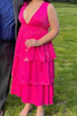 I got so many compliments on this dress at a friend's wedding. It's a little tight (ZERO stretch) but pretty TTS-sizing up likely not a great idea if you don't have the bust to hold it up, which I don't.
Recommend this dress highly! - Julianne R.