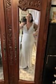 It was a little big in the bust so I'm having that part taken in along with sewing cups in,  and of course it was too long because I'm only 5'3" so I'm having it hemmed. But it's truly a very flattering dress. . - Lana S.