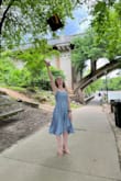 Bought this dress for my graduation, and it worked perfectly. It's a bit longer than I would have liked, but I knew that going in. It gapes the tiniest bit on the sides if you're wearing a "stick on" bra, but I don't think it was really noticeable. Will wear again if I have a nice-ish event to go to! Would be perfect for a wedding. The bow on the back is a very cute touch. - Liz P.