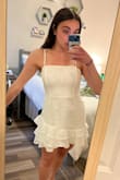 This dress is SO flattering! I was worried about my rolls being shown through the material, but the quality holds it all together very well. It's a nice, thick but at the same time light quality. ALSO-- NOT see through at all. And adjustable straps is a plus. I will definitely be wearing it to graduation! The ruffles also give such a gorgeous touch and the outside layer of fabric is a really elegant design. Definitely buy this! So glad I got off the waitlist and brought it right away! - Angelica S.