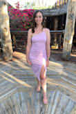 Seriously loved this dress- it was the perfect combination of classy with a little flirty detailing (the open back with straps and slit!). The top was a bit loose with the medium size and with the open back, trying to find a bra that didn't show was a little difficult (seems showing with most sticky bras). Overall, it was great and I would definitely recommend it to anyone considering it. - Amanda H.