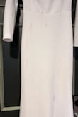 This dress fit great! The weight of the fabric made it lay so beautifully. We partied hard at the reception and I got a lot of rose wine and dirt from photos on it. But I only lost one button. Definitely recommend this dress again! - Stephanie S.