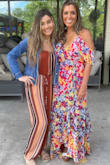 I absolutely love this dress!  I originally ordered a small but it wouldn't zip at the very top so returned for a medium.  It is long and definitely drags on the floor, I wear 6 inch heels so that helped.  It's made of good quality material.  Everyone was complimenting my look!  The colors are great, the fit is perfect, it's so soft and feminine looking.  Great for weddings, church, girly get togethers or an afternoon date. - Antoinette C.