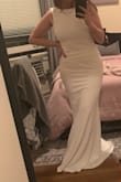 Wearing this as a maid of honor dress but was shocked by the fit/quality. I'll want to wear shape wear to just ensure all looks good/smooth, but the material is relatively thick and the length is long (if you're tall, I'm clearly not). - Kirsten M.