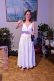 I got this dress for my civil ceremony and it was the perfect choice! Delicate and classy without being super formal. The material is good quality, it's relatively heavy. Adjustable straps were very useful. I have a smaller bust and a bigger hips, which puts me between sizes on some dresses, but since this dress is loose below the waist I went with an XS and it fit perfectly. The only problem I ran into was that it is surprisingly long. I'm about average height (I'm 5'5) but this dress swamped my feet even in heels. I had to get 4 inches taken off, which turned out perfectly but was an added step I didn't anticipate. Overall super happy with the dress and after agonizing over so many choices, I'm very glad I chose this one! - Amber F.