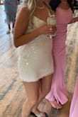 I bought this for my mom to wear at her reception - the material was soft, sparkly and had just the right amount of stretch. She looked so beautiful. The strap did break but it could have been the wild dancing that did it in. - Sakoya L.