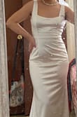 I was unsure about buying this dress since it didn't have any reviews, but I still went for it. It's beautiful and fits just right and shows off my curves. I am short so it's pretty long on me, I would need to get it hemmed. Also has a beautiful train. it's a bit snug on my tummy, but shape wear can help with that. Overall it's beautiful and a classic dress. - Ashley A.