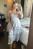 I am usually in between a small and medium, but very happy that I went with a small! The chest area has a lil give so it wasn't too tight. Wore it to a spring wedding w cowboy boots and got a million complements! - Ava