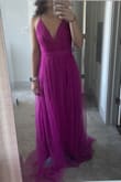 The color on the online photo is more of a pink but the actual dress is more magenta/fuchsia. I ordered in a S (normally get XS) because that's all that was available and have to get it tailored. Would definitely say it is sized as a S (just too big for me but was expected). A true statement piece that looks different from all the normal black tie dresses. Excited to get it back from the tailor and see what it looks like! - Kaleigh D.