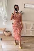 I immediately fell in love with this when I saw it online. It is perfect for a spring wedding and bonus that it a two piece so I can wear them separately (and on more than one occasion).
I am in between sizes (small and medium), so bought both to try on. I am pear shaped so the small was too tight to walk comfortably. I ended up getting the medium knowing that I would need to take it in for alterations. We took in the sides and sewed the pockets down to avoid the puckered appearance that other reviewers mentioned. I kept the length as is because I think it looks more modern long.
You will definitely need to alter the pieces to make it fit you since the fabric does not stretch. I received lots of compliments wearing this outfit. The photo is after the alterations were done. - Cindy P.
