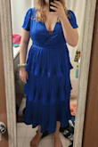 The dress is made of pretty good material, but if you're tall, probably not for you. I have to have it for a bridesmaid dress or I wouldn't have kept it, I had to size up not because I needed a better dress but because the waistline was hitting right under my bust and flaring out from there which was very unflattering and made me look like I don't have a waist.
With it sized up it's better but waistline still hitting a little too high, and it's too big and loose in the bust so I have to alter it.
If you are short it may be too long, but if you're medium height with a short torso then this may be the dress for you.
It's just not designed terribly well for people with longer torsos.
First photo is size L, before getting a size up, 2nd photo is size XL which is too big in the bust. - Caitlin W.