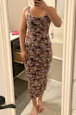 Although a body con dress this was super comfortable. I'm usually a small or a medium but sized down based on reviews. The colors did not bode well for my complexion so I returned it. Very comfortable though! - Tara Y.